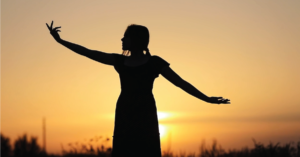 Video thumbnail photo of person standing in front of the sun with their arms outstretched