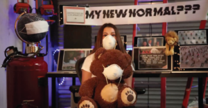 Video thumbnail that shows a person wearing a mask holding a stuffed animal also wearing a mask in front of banner that says "My New Normal?"